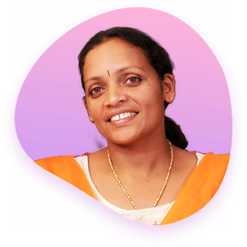 a lady smiling wearing orange suit with gradient background having pink and purple color